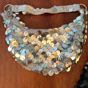 Fancy silver shoulder handbag.  Used but in good condition. No rips or stains